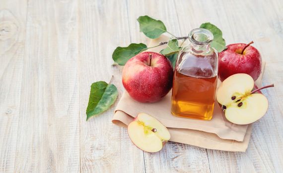 Apple cider vinegar in a bottle. Selective focus. nature.