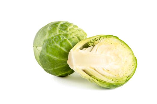 Brussels sprouts on a white background. Fresh small Brussels sprouts, cut in half, Brussels sprouts texture.