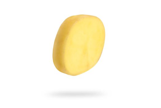 A slice of fresh unpeeled potatoes falls on a white background. Chopped raw potatoes. Food levitation concept. High resolution image.