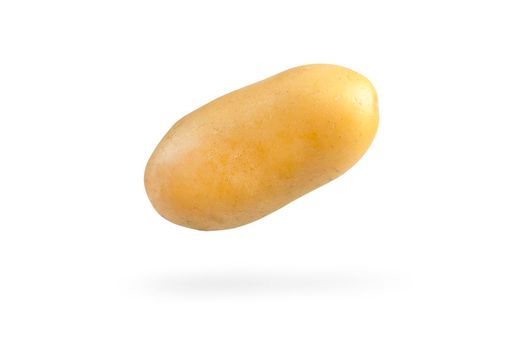 Fresh unpeeled potatoes, isolated on white background. Flying potatoes on a white isolated background casts a shadow