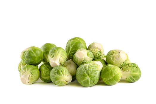 Brussels sprouts, isolate. Fresh, small Brussels sprouts stacked in a stack on a white isolated background