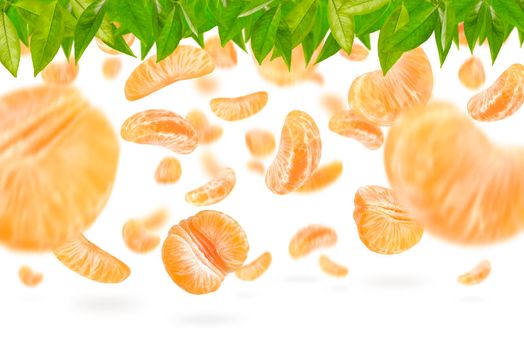 Falling mandarin slices on a white isolated background. Citrus fruit background, yellow tangerine slices with selective focus.