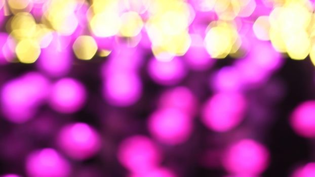 Abstract colorful bokeh light on golden background. Christmas and New Year theme