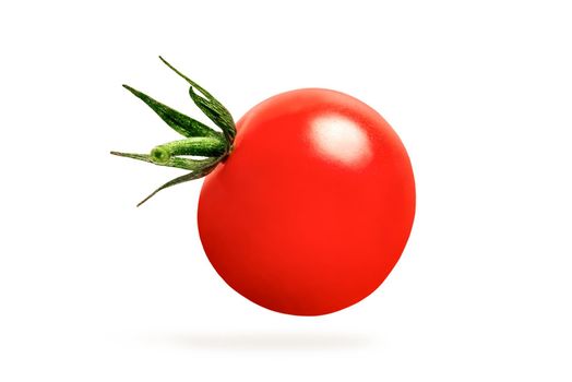 Cherry tomatoes isolate on white. one tomato hanging in close-up, casting a shadow