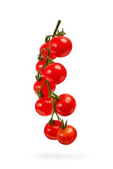 Cherry tomatoes isolate on white. A bunch of small tomatoes close-up, small red tomatoes on a branch casts a shadow