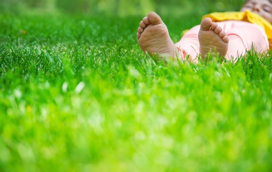 The child lies on the grass. Selective focus. nature.