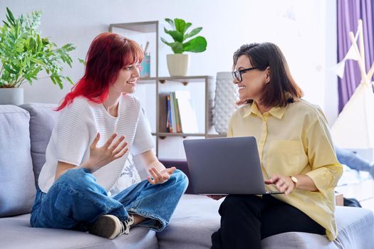 Therapy session for teenage girl, psychologist and patient together on couch in office. Social worker, concellor helping talking to teenager. Mental health, adolescence, psychology, psychiatry concept