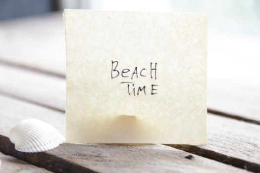 Sign with the inscription beach time. Summer travel concept.