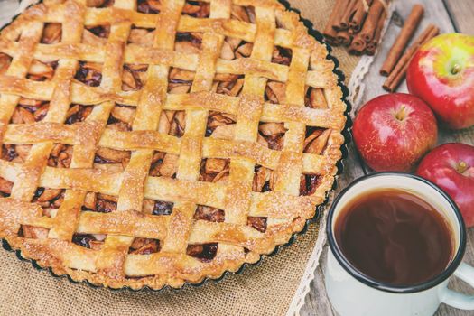 Pie with apples and cinnamon. Selective focus. Food.