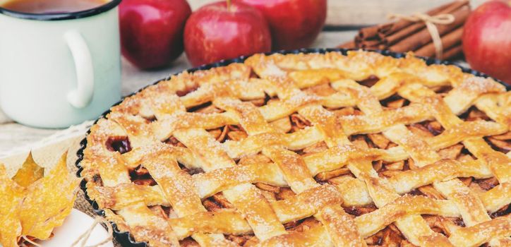 Pie with apples and cinnamon. Selective focus. Food.