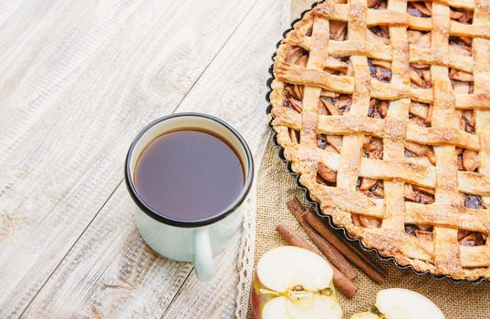 Pie with apples and cinnamon. Selective focus. Food.
