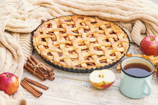 Pie with apples and cinnamon. Selective focus. Food.