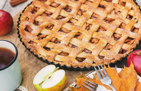 Pie with apples and cinnamon. Selective focus. Food.