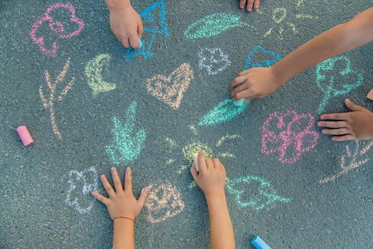 Children's drawings on the asphalt with chalk. Selective focus. nature.