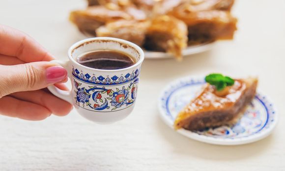 Turkish coffee and baklava on the table. Selective focus. nature.