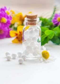 Homeopathy. Herbal extracts in small bottles. Selective focus. nature.