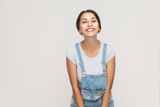 Beauty, youth and skin care concept. The attractive beautiful woman with perfect clean skin looking and smiling at camera with happy and joyful. Studio shot