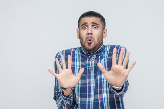 It's not that. Shocked businessman posing on gray background. Isolated, studio shot