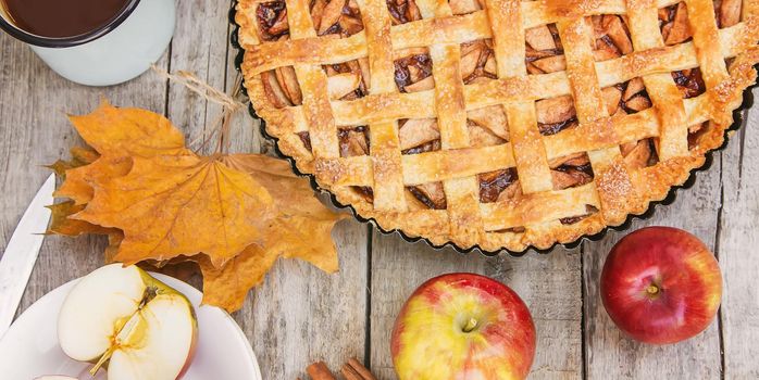 Pie with apples and cinnamon. Selective focus. Food.