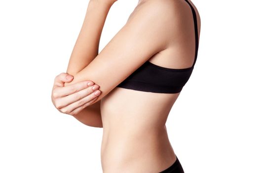 Closeup view of a young woman with elbow pain on white background.