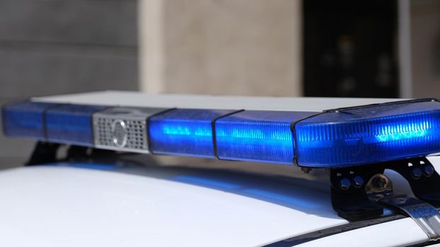Police car with red and blue warning lights. Light panel and siren on roof, ambulance municipal police.