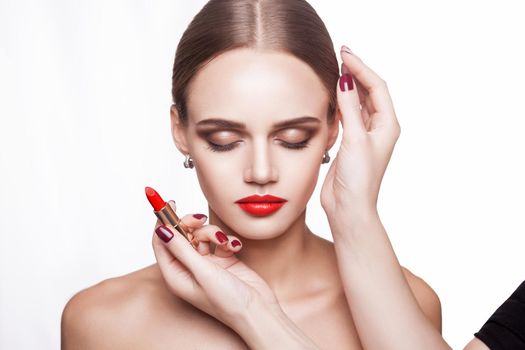 Closeup portrait of woman hand apply makeup on face. beauty and health care concept.