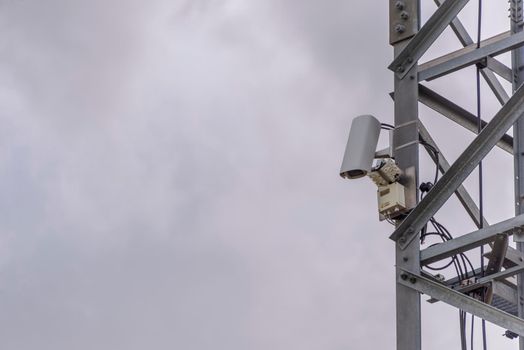 CCTV cameras on tile building exterior with copy space. Surveillance concept