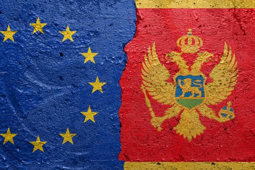 European Union and Montenegro flags  - Cracked concrete wall painted with a EU flag on the left and a Montenegro flag on the right