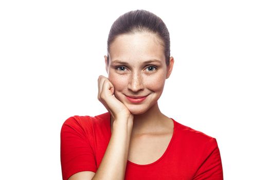 Portrait of happy smiley woman in red t-shirt with freckles. looking at camera, studio shot. isolated on white background. .