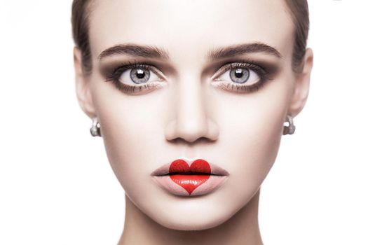 Portrait of beautiful woman with makeup and red heart shape on her lips. valentines day and beauty love and care concept. indoor studio shot, Isolated on white background.