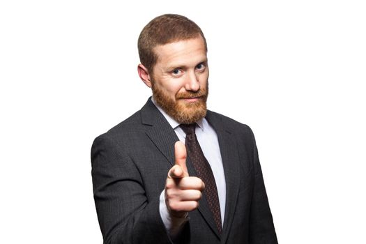 Serious handsome businessman pointing finger to you. studio shot, isolated on white..