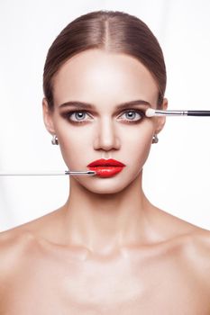 Closeup portrait of woman hand apply makeup on face. beauty and health care concept.