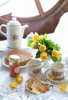 breakfast with pancakes and apple jam for pancake week, spring still life on the window. High quality photo