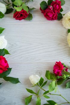 beautiful background of many red roses on a light wooden
