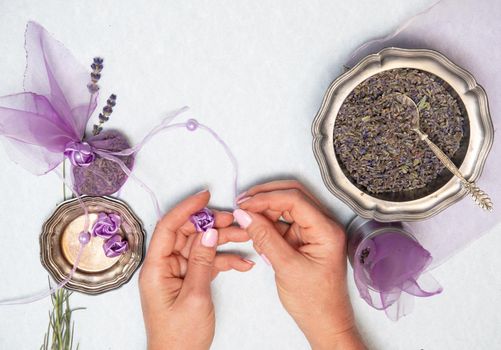 handmade lavender sachet DIY, step by step instructions, step four ,Female hands in the frame