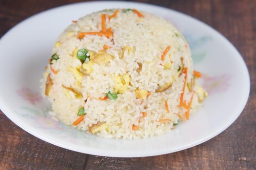 cooked rice in a bowl on table, close up