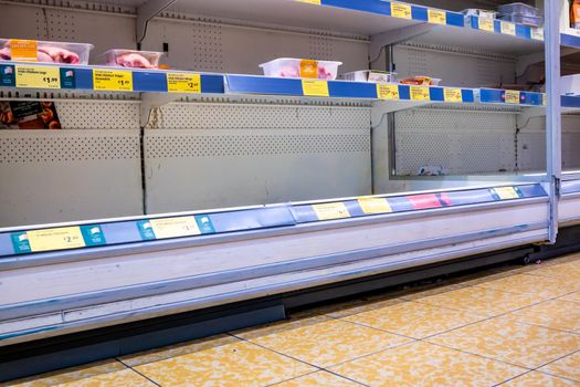 DUNGLOE / IRELAND - MARCH 17 2020 : The chicken shelves are empty during the coronavirus outbreak.