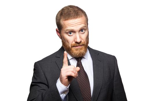 Serious Businessman showing no sign with his finger against a white background. studio shot, isolated..