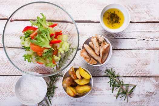 Ingredients for vegetable salad with chicken breast on a plate. Stock image.