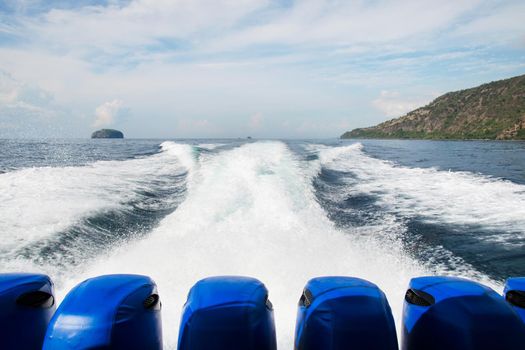 Water trail behind moving motor boat. Stock image