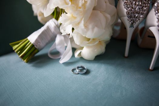 wedding rings and roses bouquet. stock image.