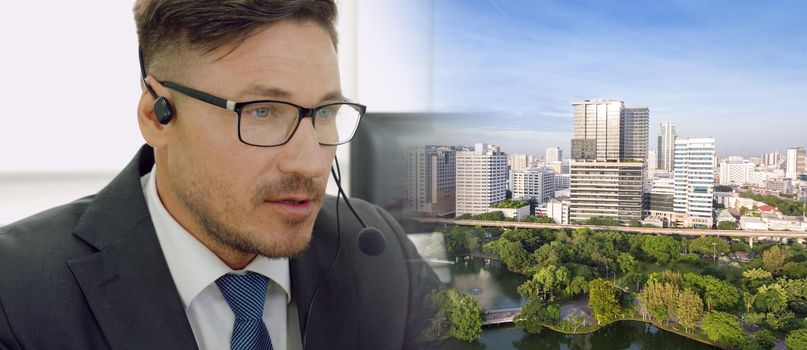 Business people wearing headset working in office to support remote customer or colleague. Call center, telemarketing, customer support agent provide service in broaden view .