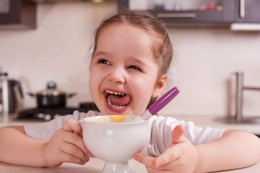 Girl spoiled and naughty food. Stock image.