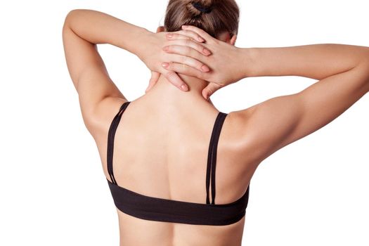 Closeup view of a young woman with shoulder or neck pain on white background.