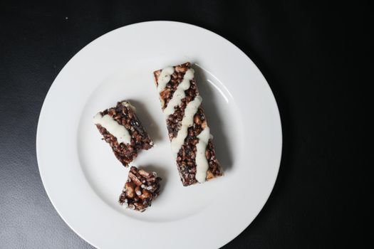 peanut, chocolate and oat protein bars on table ..