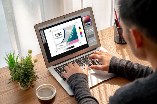 Graphic designer software for modern design of web page and commercial ads showing on the computer screen
