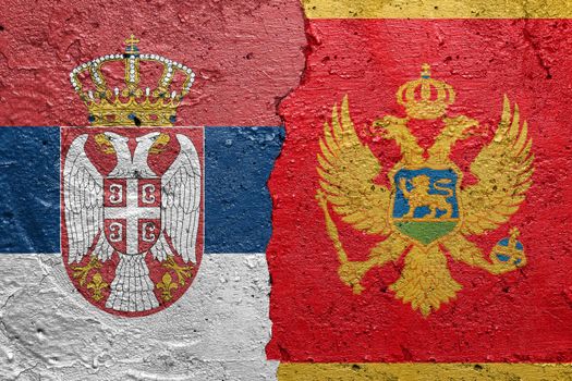 Serbia and Montenegro flags  - Cracked concrete wall painted with a Serbian flag on the left and a Montenegrin flag on the right