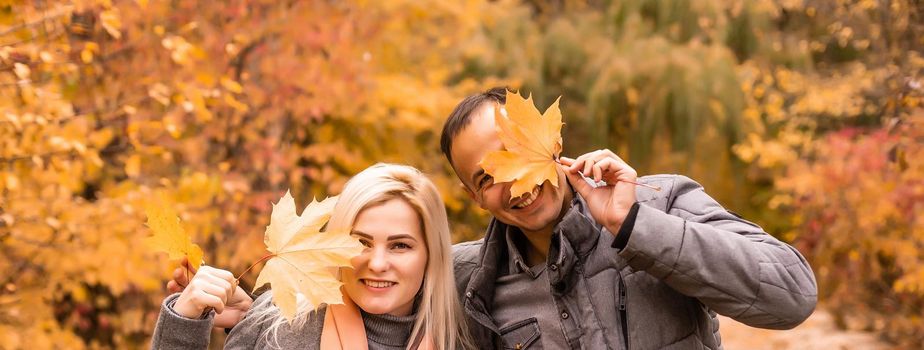 laughing smiling female and male, family in autumn park