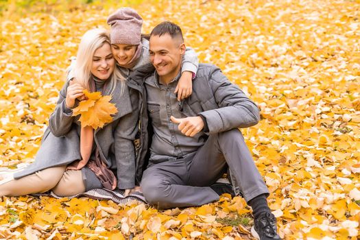 Portrait of family during the autumn.