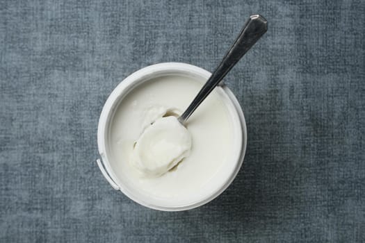 fresh yogurt in a bowl on table .
